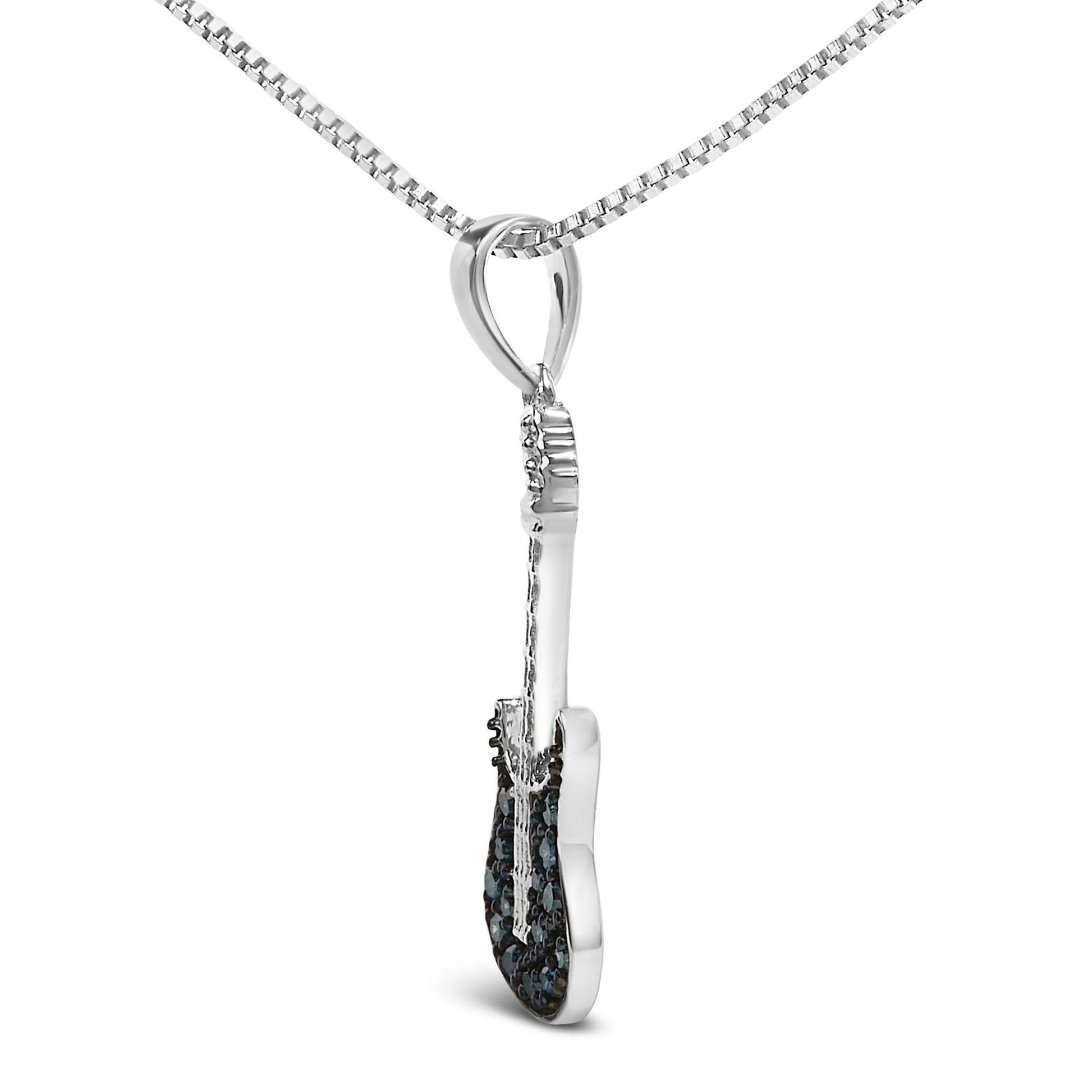 White metal necklace with a guitar-shaped pendant featuring blue round gemstones in prong settings, shown in a side angle view.