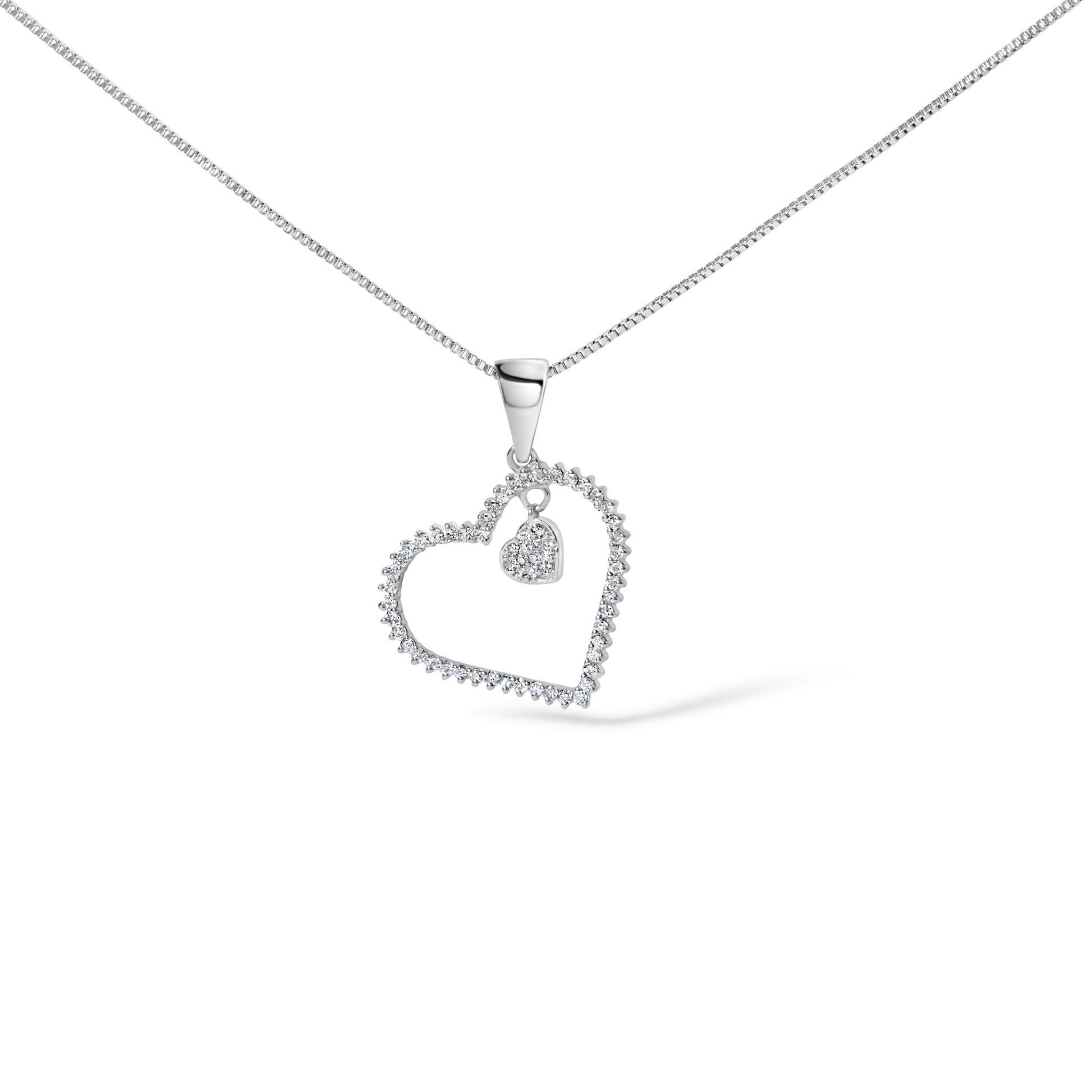 Close-up front angle of a white necklace chain with a heart-shaped pendant outlined with white gemstones, featuring a smaller heart charm with white gemstones inside, shown on a white background.