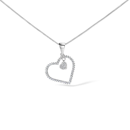 Close-up front angle of a white necklace chain with a heart-shaped pendant outlined with white gemstones, featuring a smaller heart charm with white gemstones inside, shown on a white background.