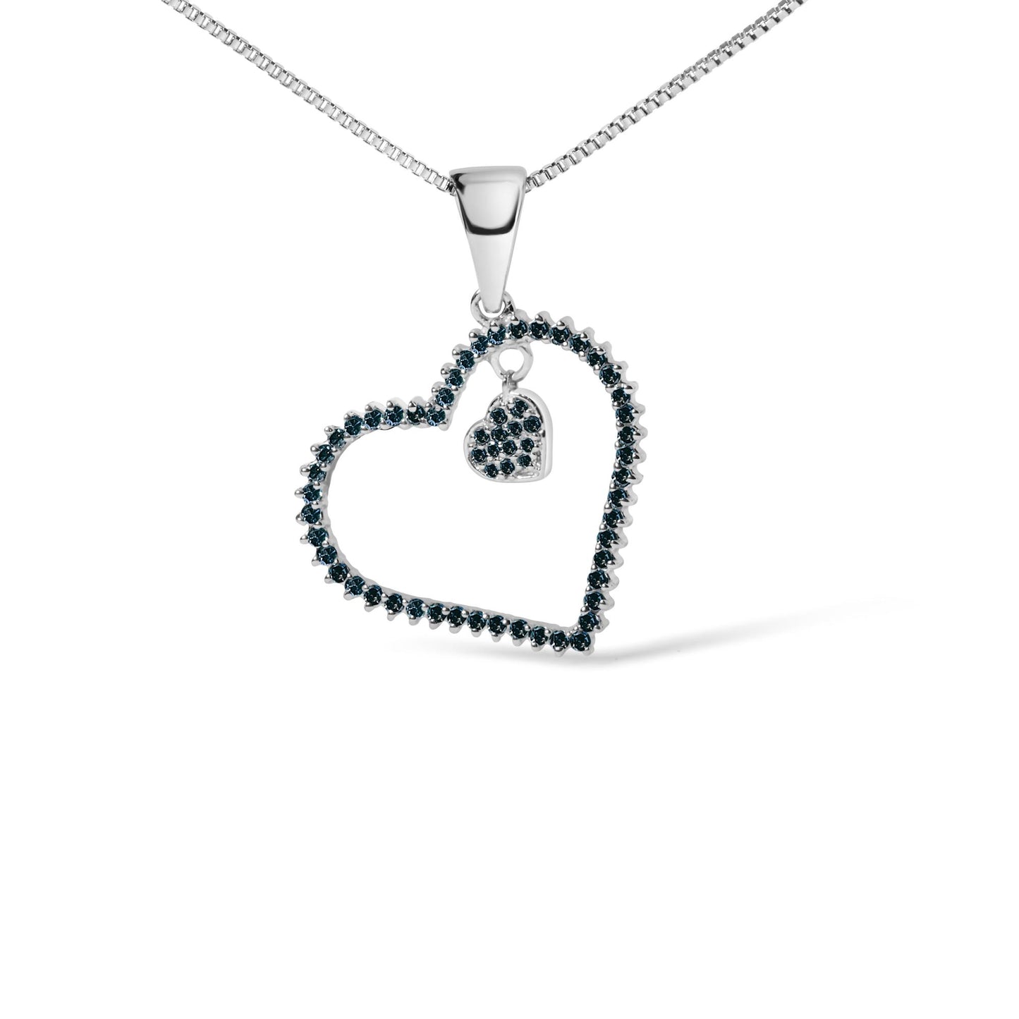 Close-up front angle of a white metal necklace with a heart-shaped pendant outlined with round blue gemstones in prong settings and a smaller heart charm inside also adorned with blue gemstones.