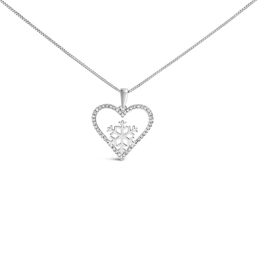 Close-up front view of a white metal necklace with a heart-shaped pendant encrusted with small white gemstones and a snowflake design inside the heart, shown on a white background.