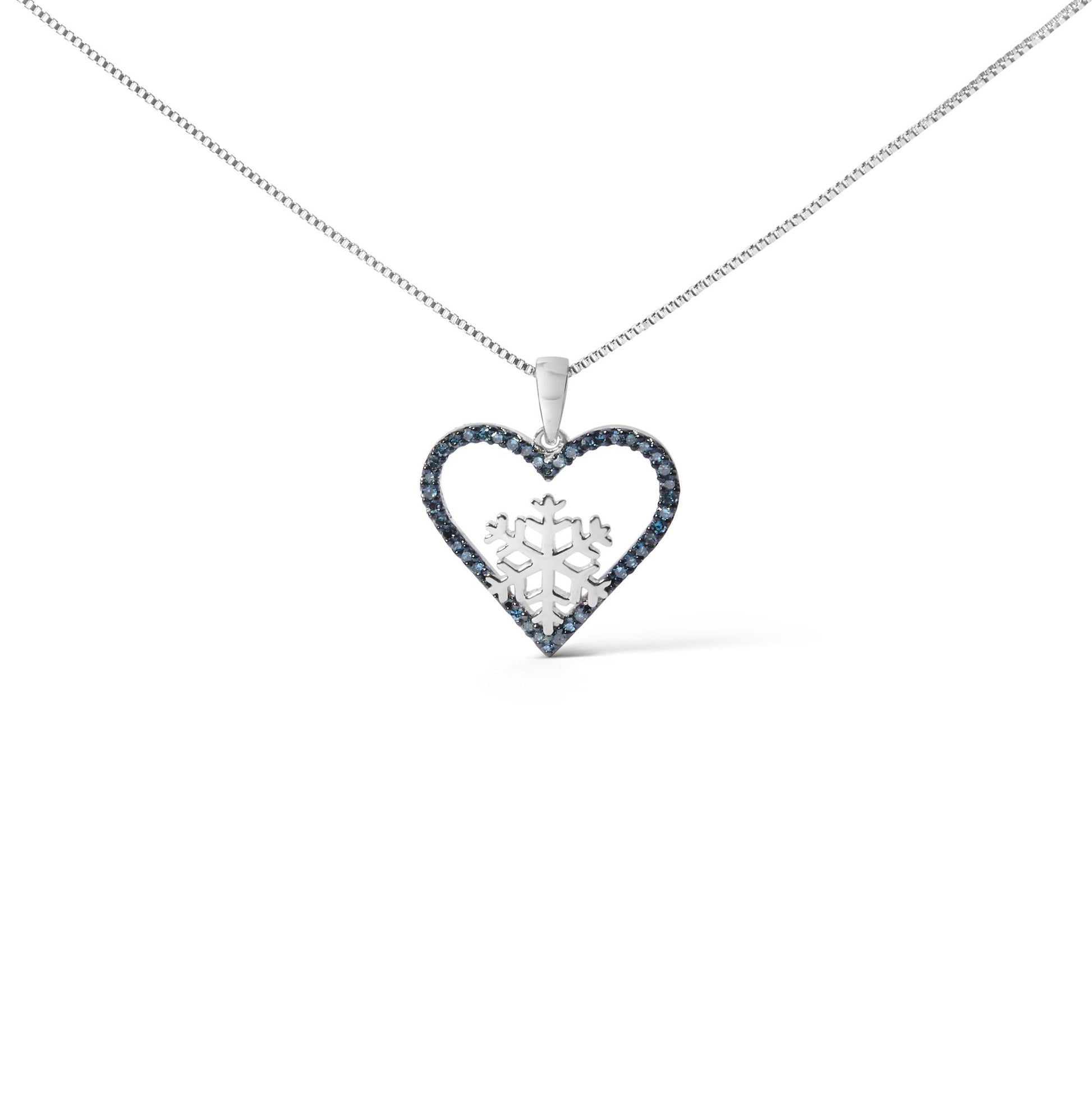 Close-up front view of a white metal necklace with a heart-shaped pendant outlined in blue gemstones and a snowflake design in the center, shown on a white background.