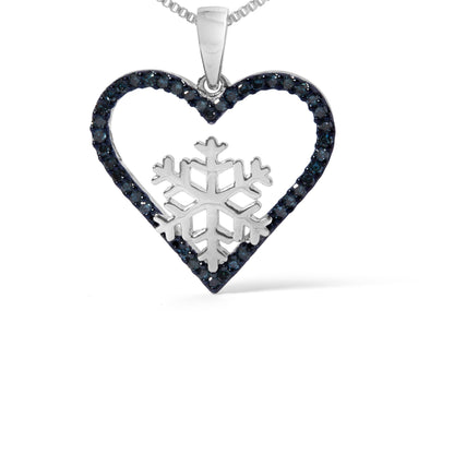 Close-up front view of a white necklace pendant featuring a heart outline adorned with round blue gemstones in prong settings and a snowflake design in the center.
