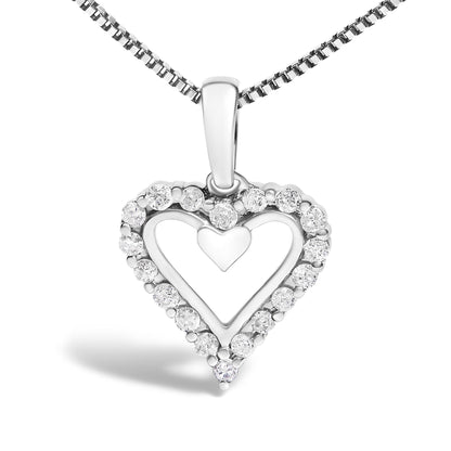 Front view of a white metal heart-shaped necklace pendant with an inner solid heart and surrounding round white gemstones in prong settings.
