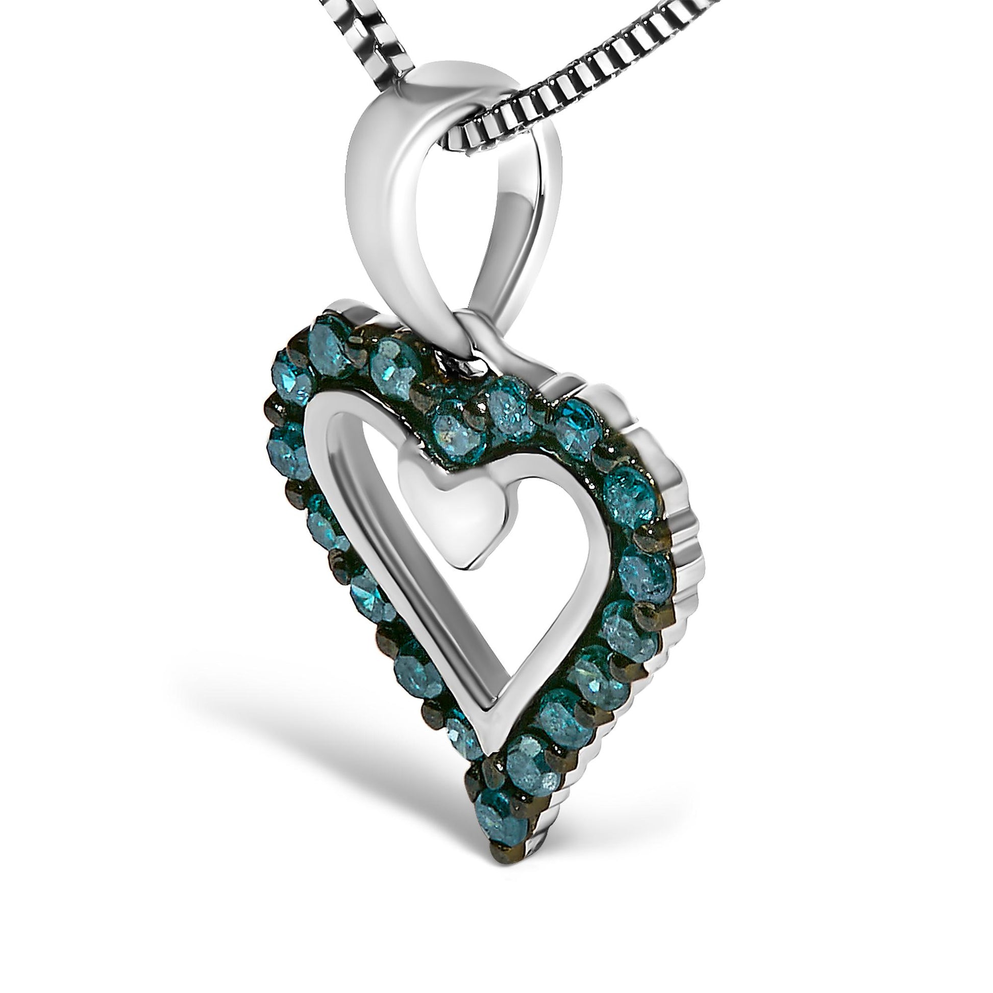Close-up angled view of a white metal heart-shaped necklace pendant with an open center, outlined with round prong-set blue gemstones on a white metal chain.