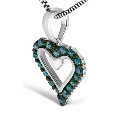 Close-up angled view of a white metal heart-shaped necklace pendant with an open center, outlined with round prong-set blue gemstones on a white metal chain.