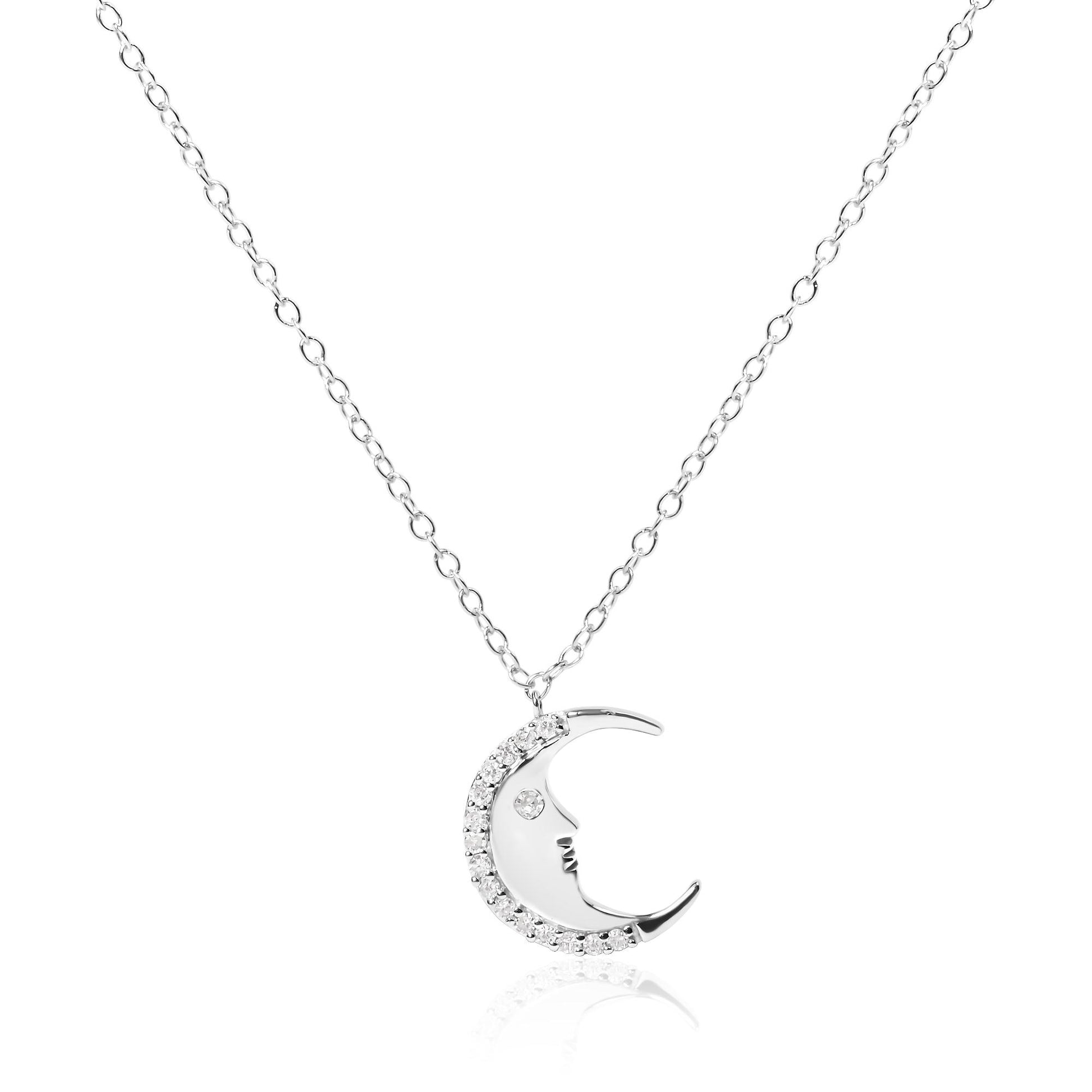 Front-facing view of a white metal crescent moon necklace pendant with round white gemstones set along the outer edge and one gemstone representing the eye.