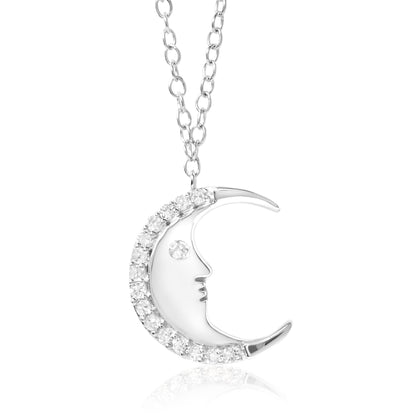 White metal crescent moon necklace pendant with round white gemstones outlining the outer curve and one gemstone for the eye, shown against a white background from a front angle.