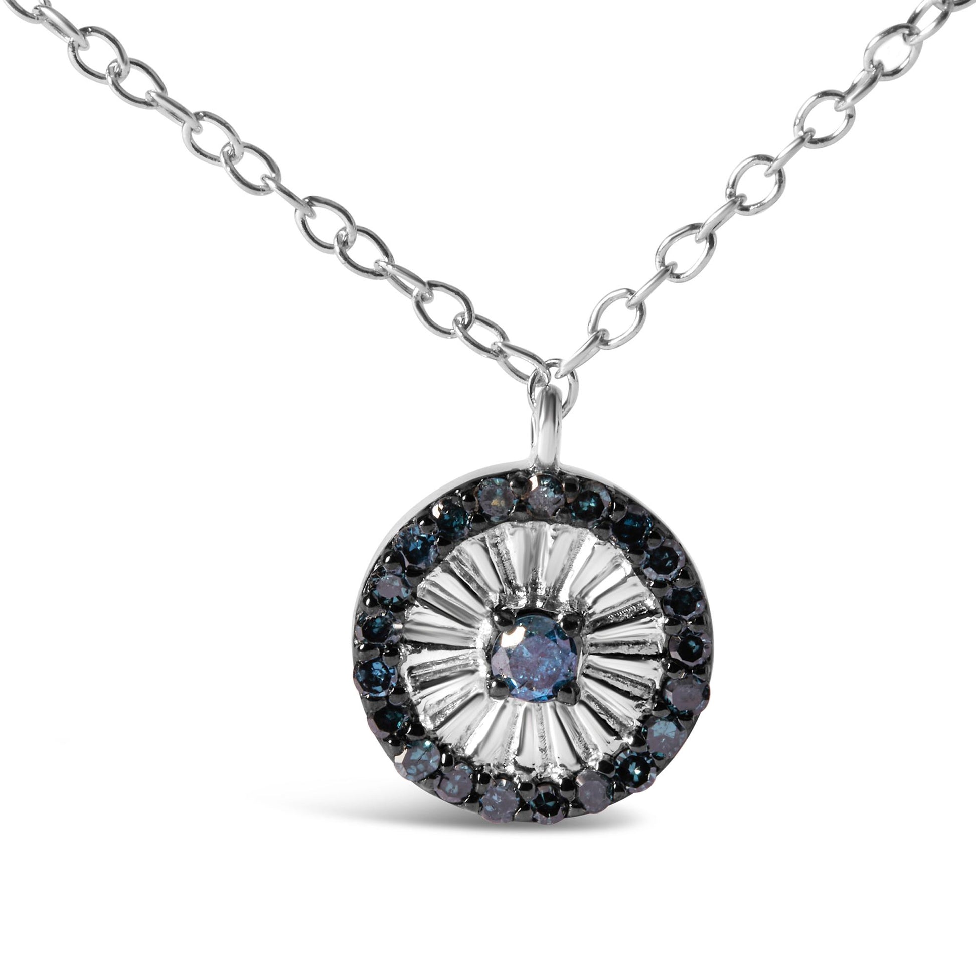Close-up front view of a white metal necklace with a round pendant featuring a prong-set blue gemstone in the center, surrounded by smaller prong-set blue gemstones forming a circular pattern.
