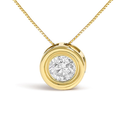 Close-up front view of a yellow metal necklace with a round white gemstone in a bezel setting pendant.