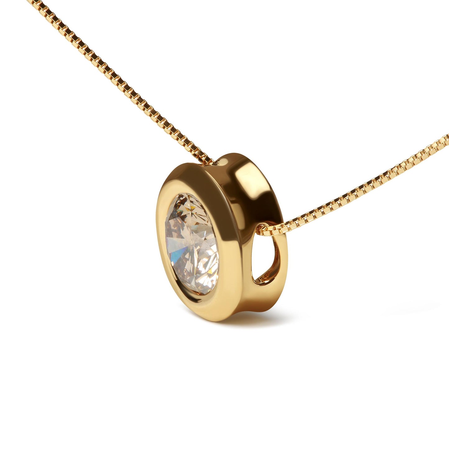 Close-up angled shot of a yellow metal necklace with a round bezel-set champagne-colored gemstone pendant.