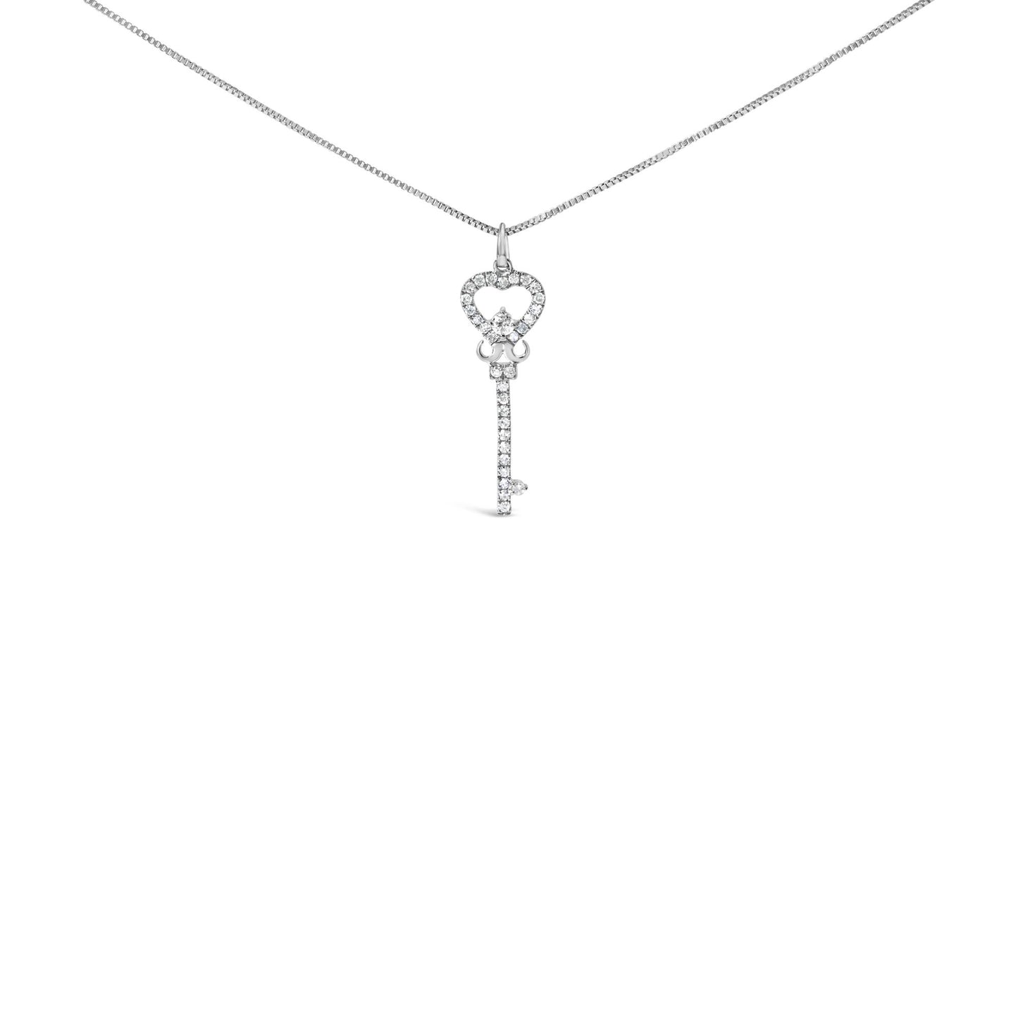 Front view of a white metal necklace with a key-shaped pendant adorned with round white gemstones in prong settings.