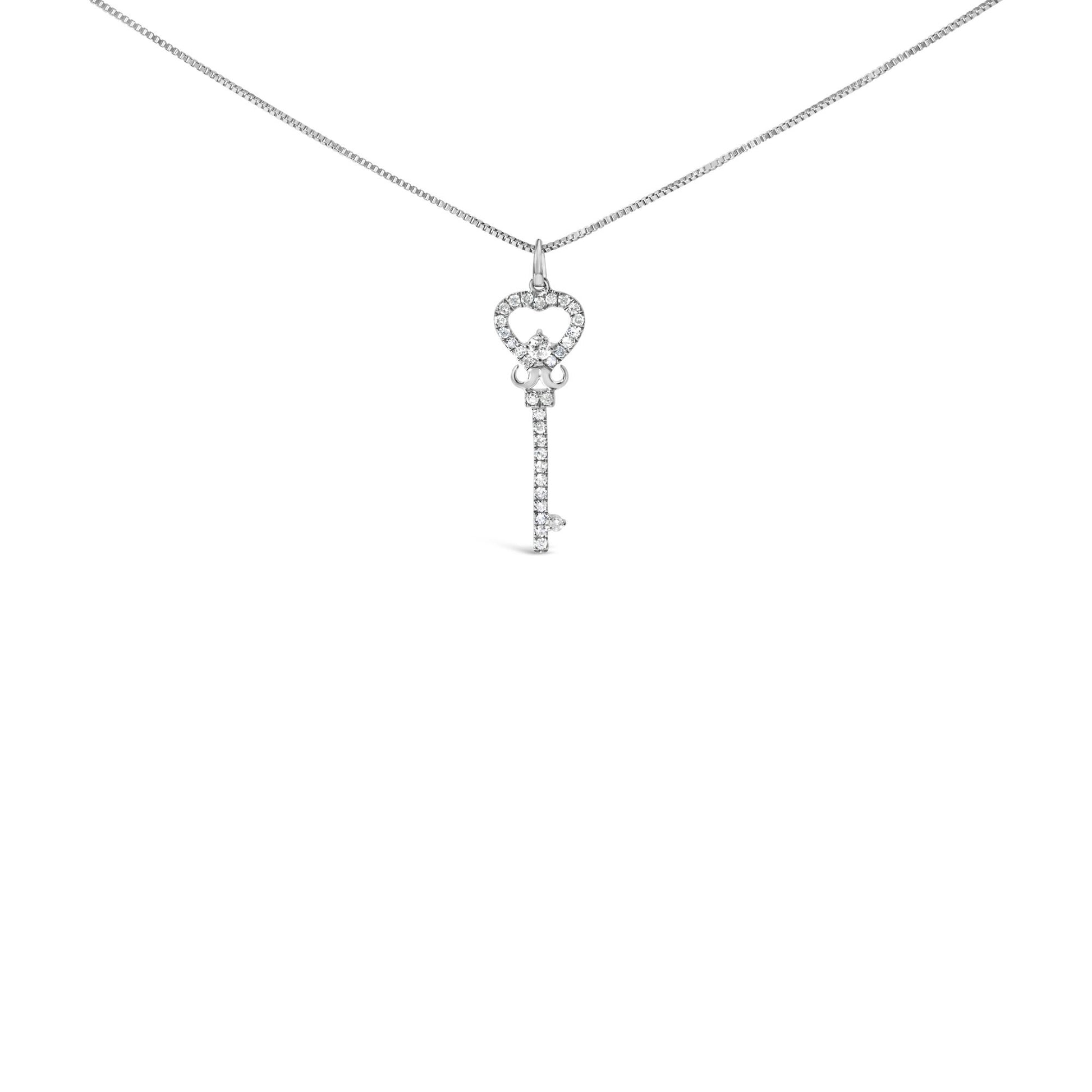 Front view of a white metal necklace with a key-shaped pendant adorned with round white gemstones in prong settings.