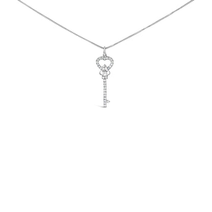 Front view of a white metal necklace with a key-shaped pendant adorned with round white gemstones in prong settings.