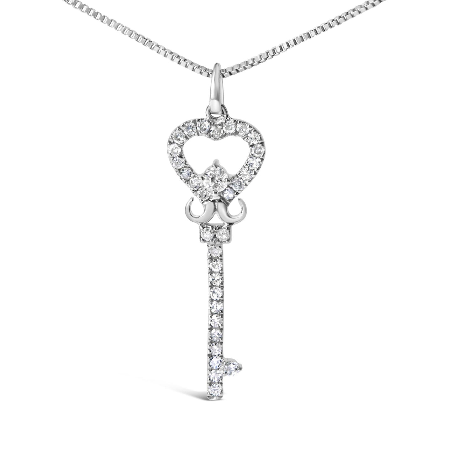 Front view of a white metal necklace with a key-shaped pendant adorned with small round white gemstones in prong settings.