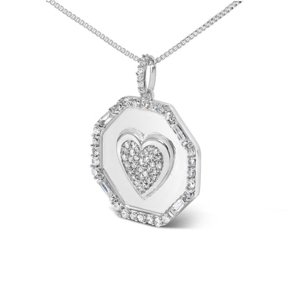 Close-up angled view of a white metal necklace pendant with an octagonal shape, featuring a heart design in the center paved with small white gemstones, surrounded by a border of round and baguette white gemstones, hanging from a chain.