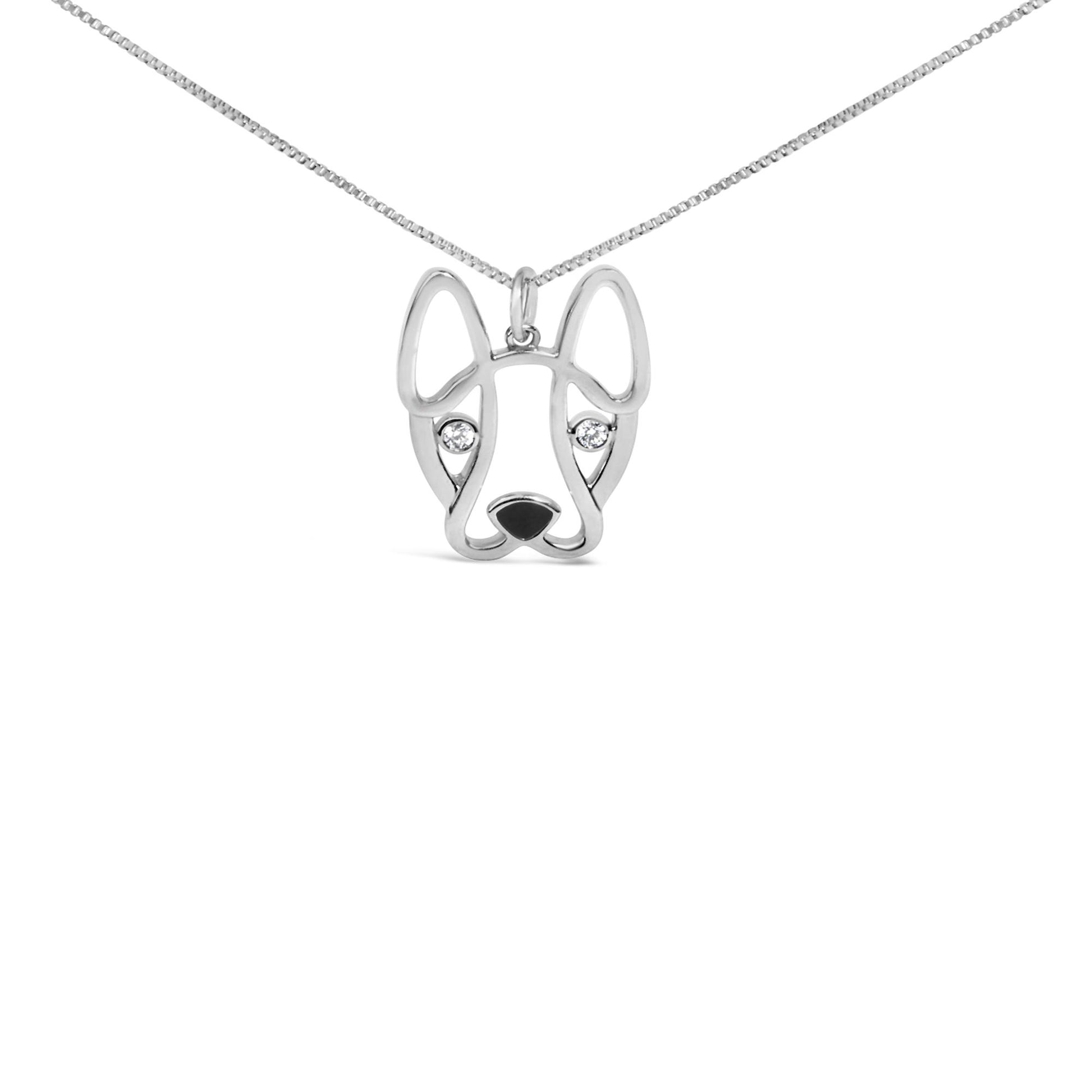 Front view of white metal necklace pendant shaped like a dog's face with two round white gemstones as eyes.