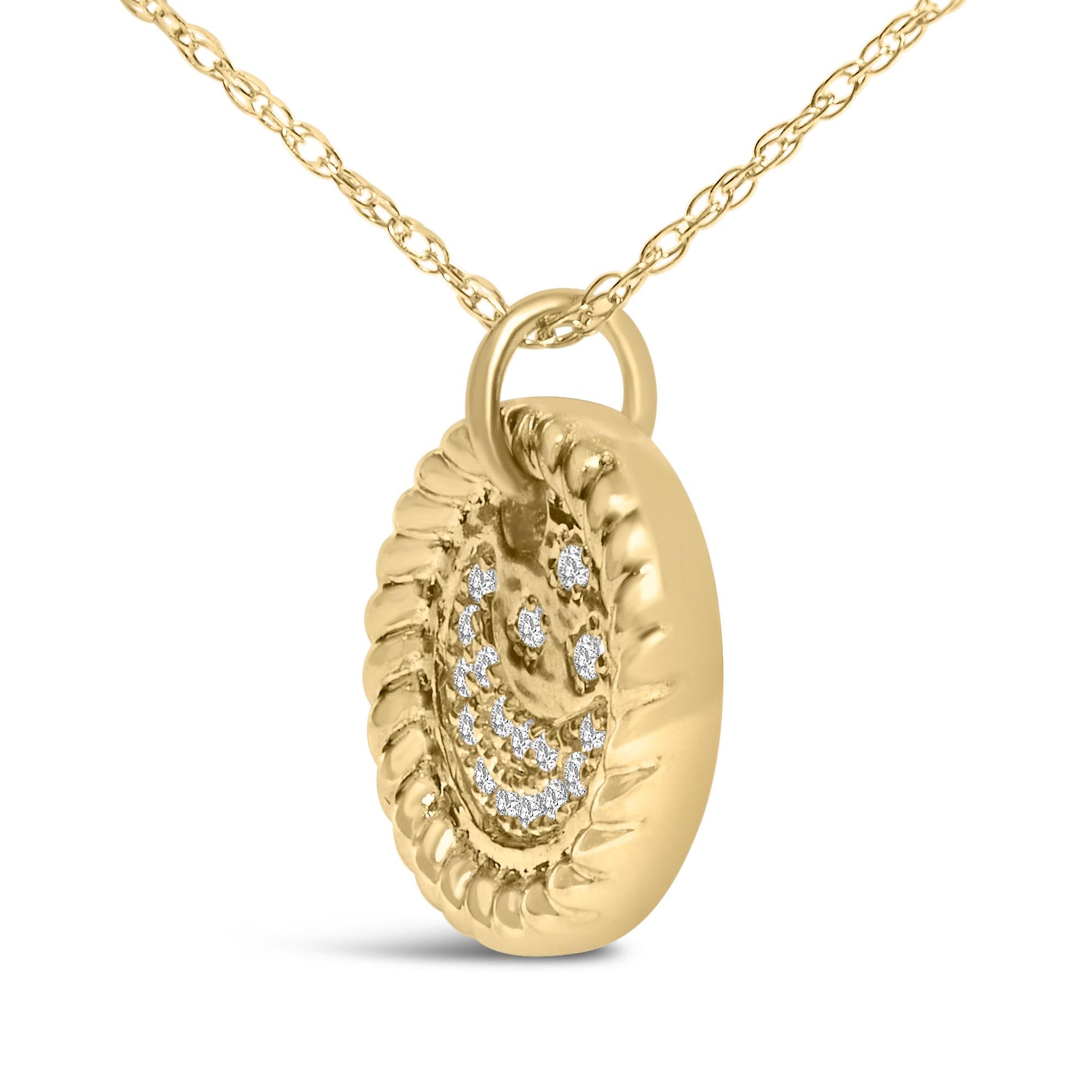 Close-up angled view of a round yellow metal pendant necklace with white round gemstones arranged in a smiley face pattern, hanging from a delicate yellow metal chain.
