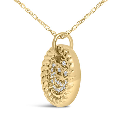 Close-up angled view of a round yellow metal pendant necklace with white round gemstones arranged in a smiley face pattern, hanging from a delicate yellow metal chain.