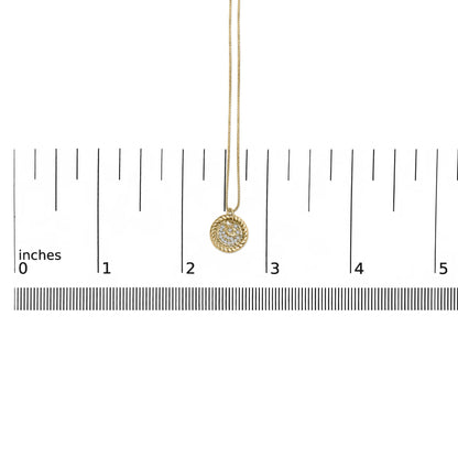 Yellow necklace with a round pendant featuring multiple white round gemstones in a prong setting, shown hanging centered on a measuring scale, front view.