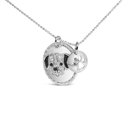 Front view of a white metal necklace with two round pendants, one featuring a dog face with white and black gemstones in micro-pave setting, and the other smaller pendant with a paw print cutout.