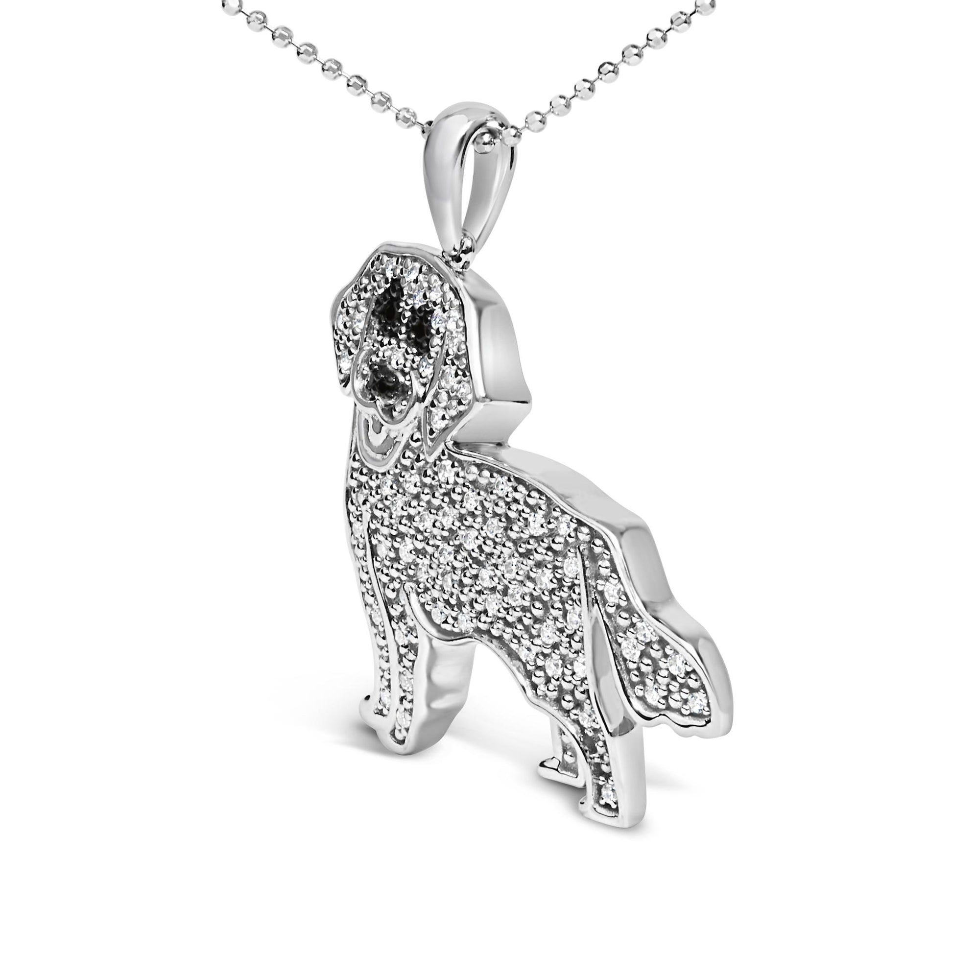 White metal dog-shaped necklace pendant with white and black gemstones in a micro-pave setting, shown at a slight angle.