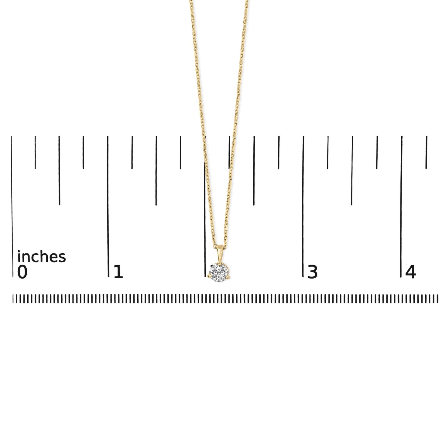 Yellow metal necklace with a round white gemstone in a three-prong setting, photographed from the front on a ruler for size reference.