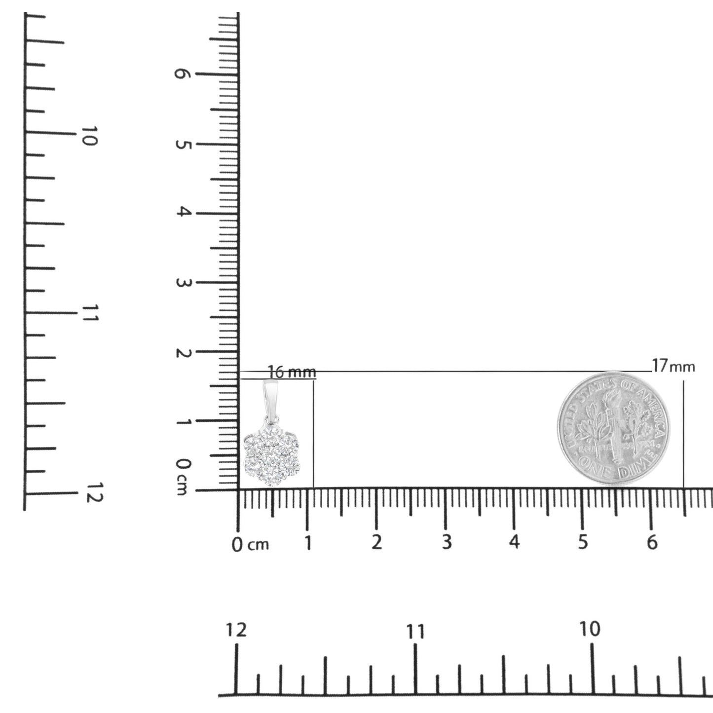 Close-up front angle of a white metal necklace pendant with seven round white gemstones in prong settings, shown on a ruler and scale for size reference.
