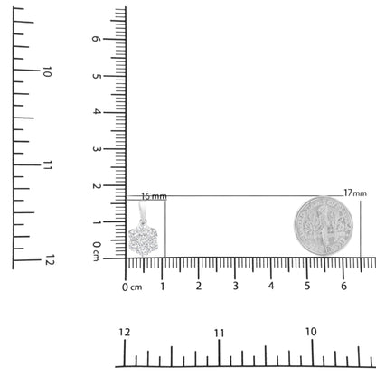 Close-up front angle of a white metal necklace pendant with seven round white gemstones in prong settings, shown on a ruler and scale for size reference.