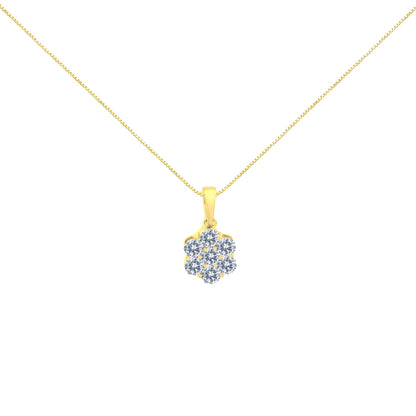 Front view of a yellow metal necklace with a pendant featuring a cluster of round white gemstones in prong settings.