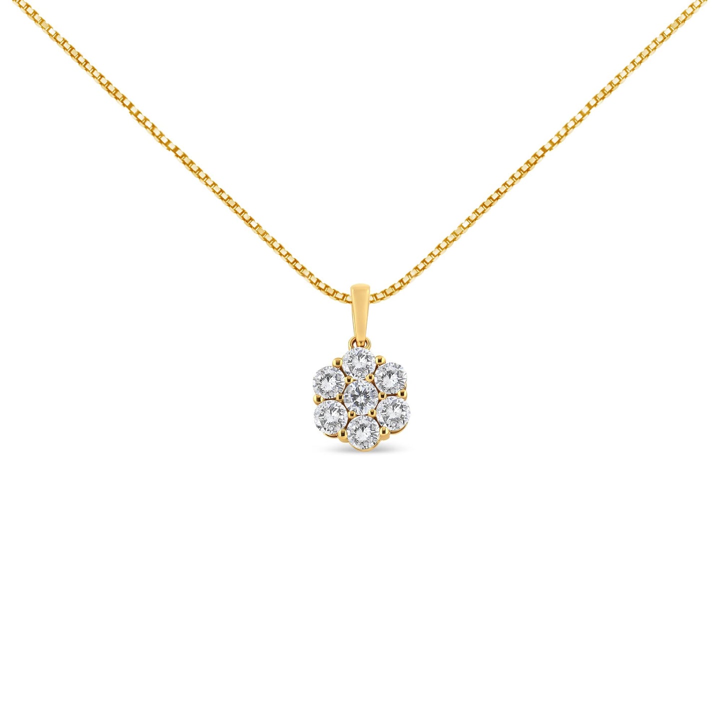 Front-facing shot of a yellow metal necklace with a pendant featuring a cluster of round white gemstones in prong settings.