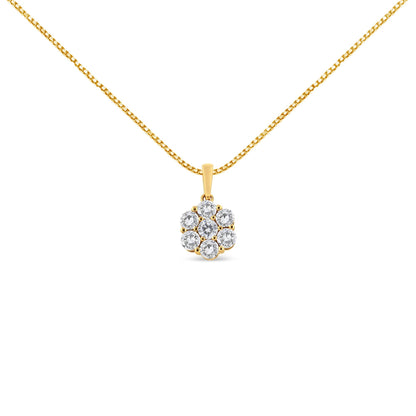 Front-facing shot of a yellow metal necklace with a pendant featuring a cluster of round white gemstones in prong settings.
