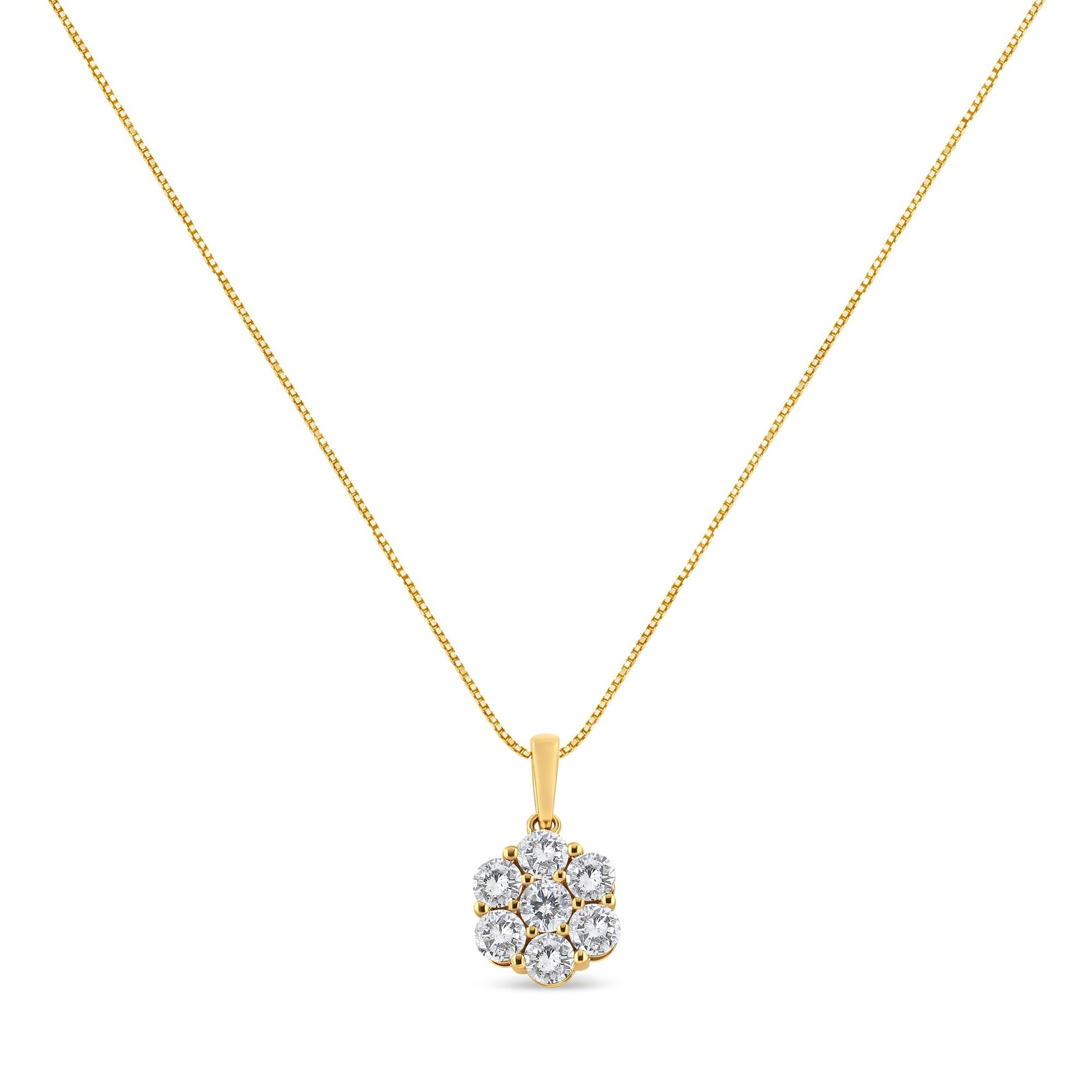 Front view of a yellow metal necklace with a pendant featuring seven round white gemstones in prong settings.