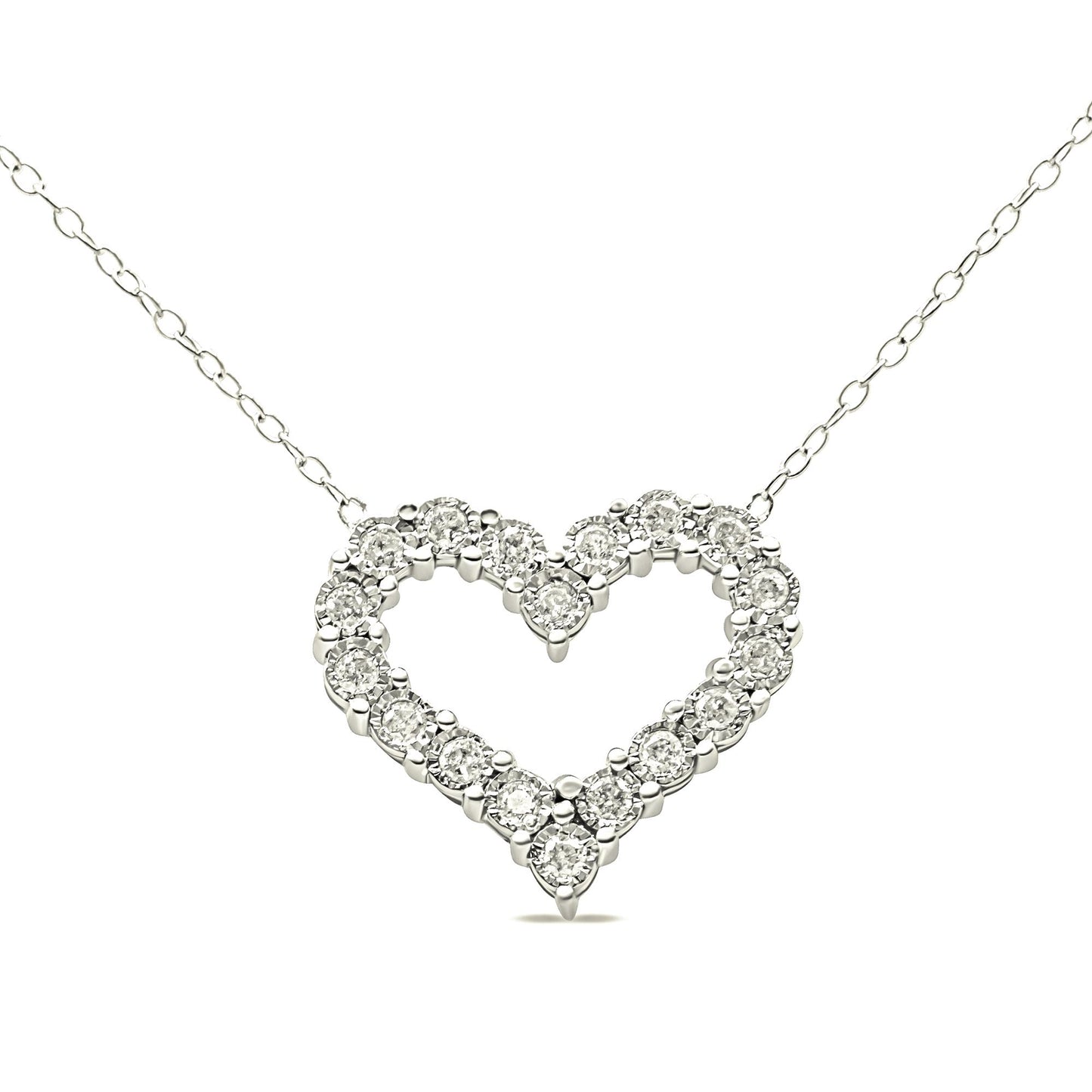 Front-facing close-up of a white metal heart-shaped necklace pendant set with round white gemstones in prong settings, suspended on a delicate chain.