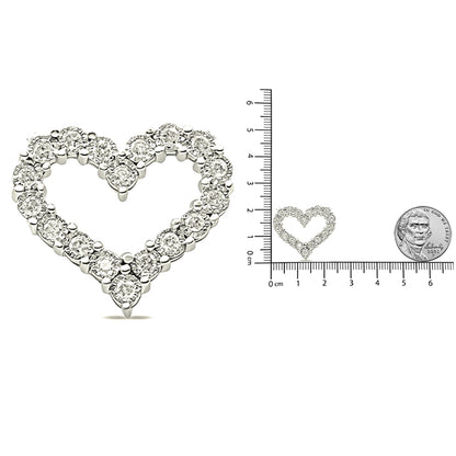 Close-up front angle of a white heart-shaped necklace pendant featuring round prong-set white gemstones, shown next to a ruler and a coin for size reference.