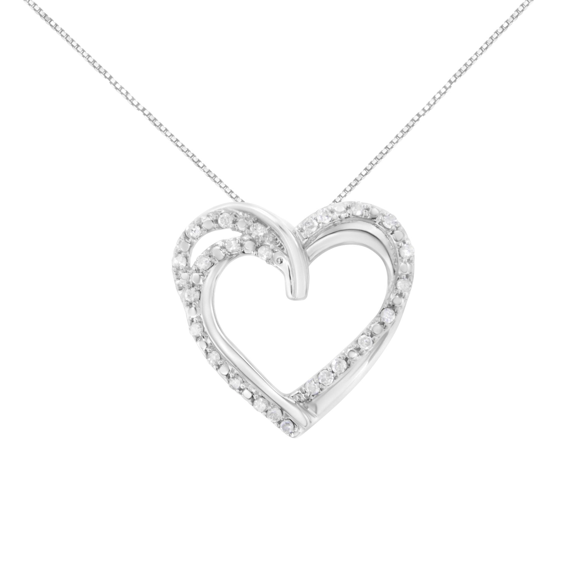 Front view of a white metal heart-shaped necklace pendant adorned with round white gemstones in prong settings on a fine chain.