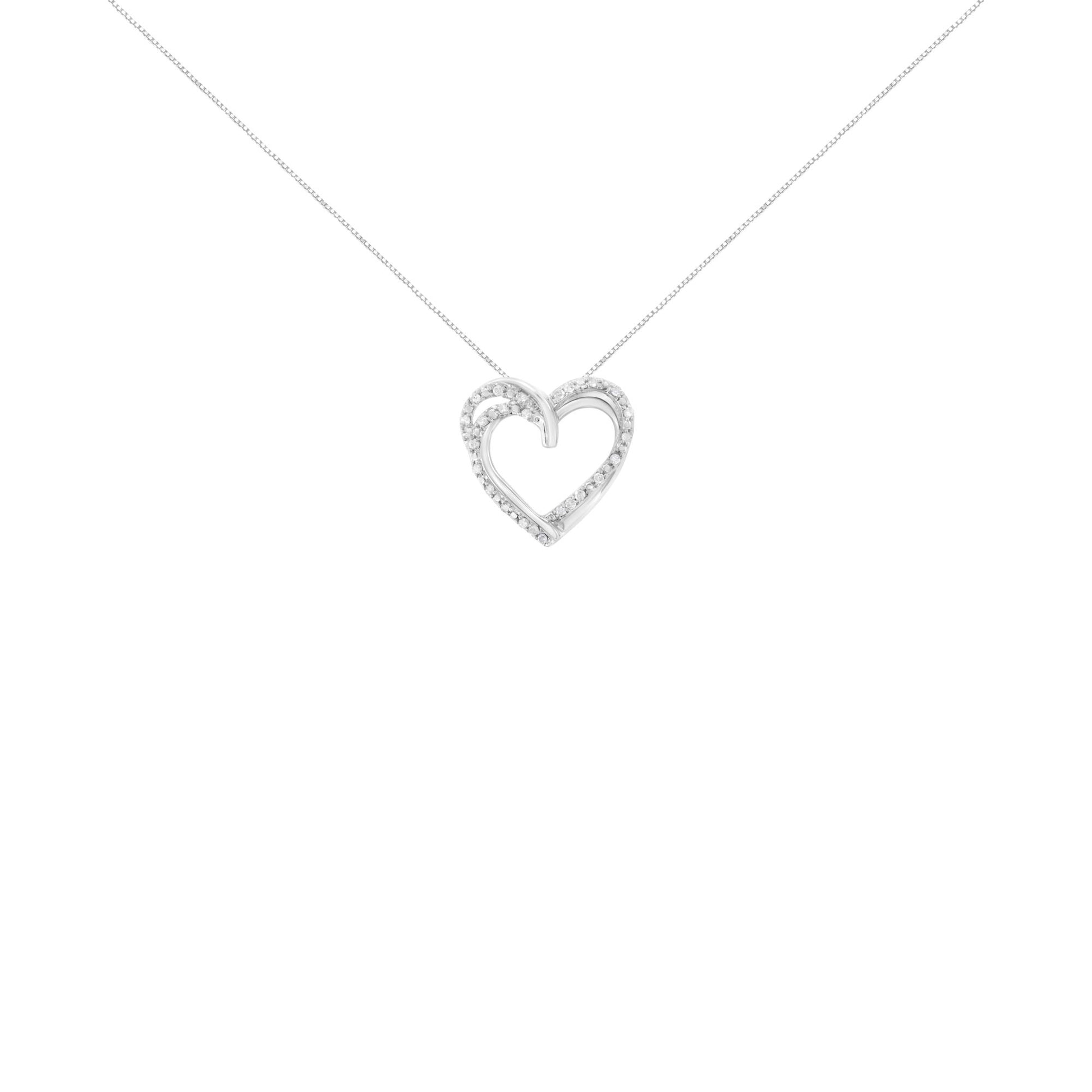 Front view of a white metal heart-shaped necklace pendant adorned with round white gemstones in prong settings on a fine chain.