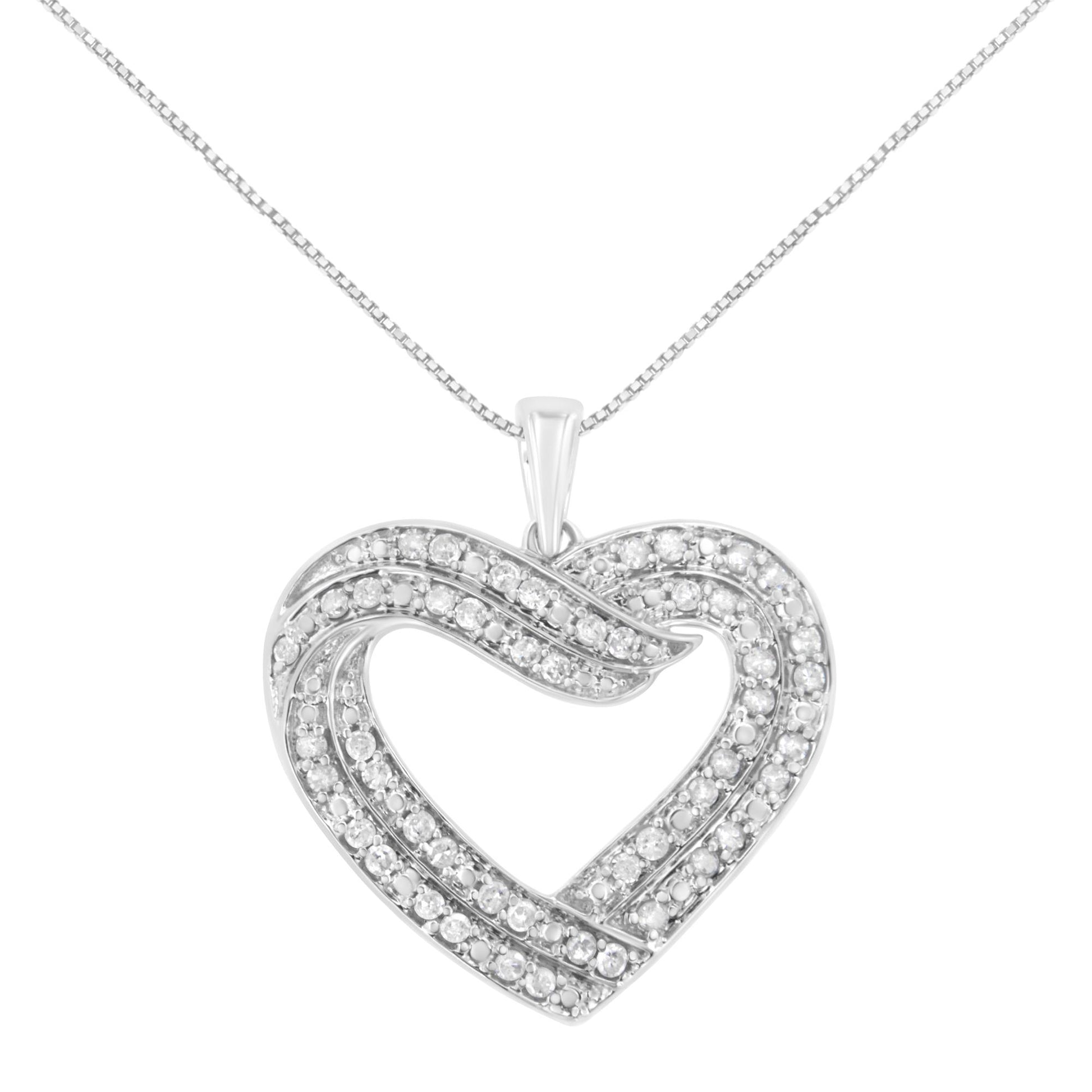 Front view of a white metal heart-shaped necklace pendant with multiple rows of round white gemstones in a prong setting on a white metal chain.