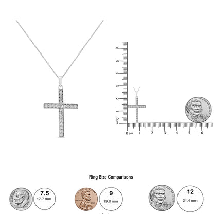 White metal cross-shaped necklace with multiple round white gemstones in channel settings, shown from the front with a ruler and coin for size reference.