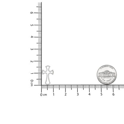 White metal cross-shaped necklace pendant with round white gemstones in prong settings, shown flat on a ruler and scale for size reference, front-facing angle.