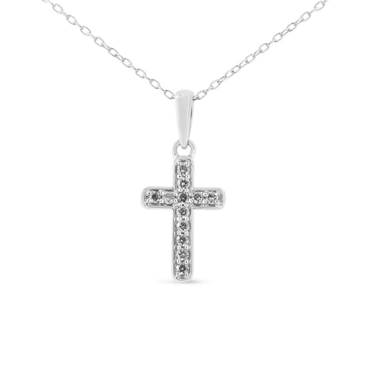 Front-facing shot of a white metal cross-shaped necklace pendant adorned with multiple round prong-set white gemstones on a delicate chain.