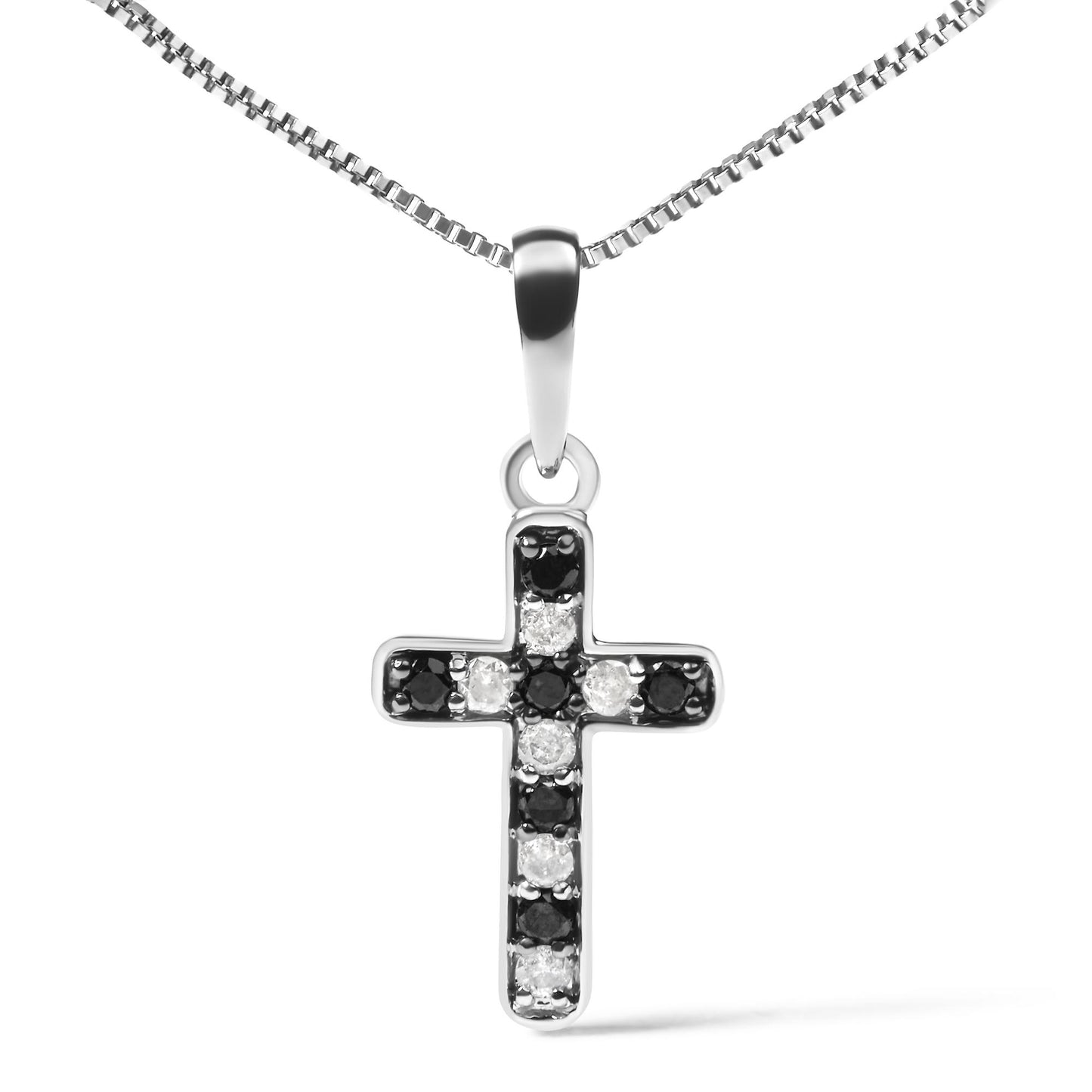 Front view of a white metal cross-shaped necklace pendant with alternating black and white round gemstones in prong settings, hanging from a white metal chain.