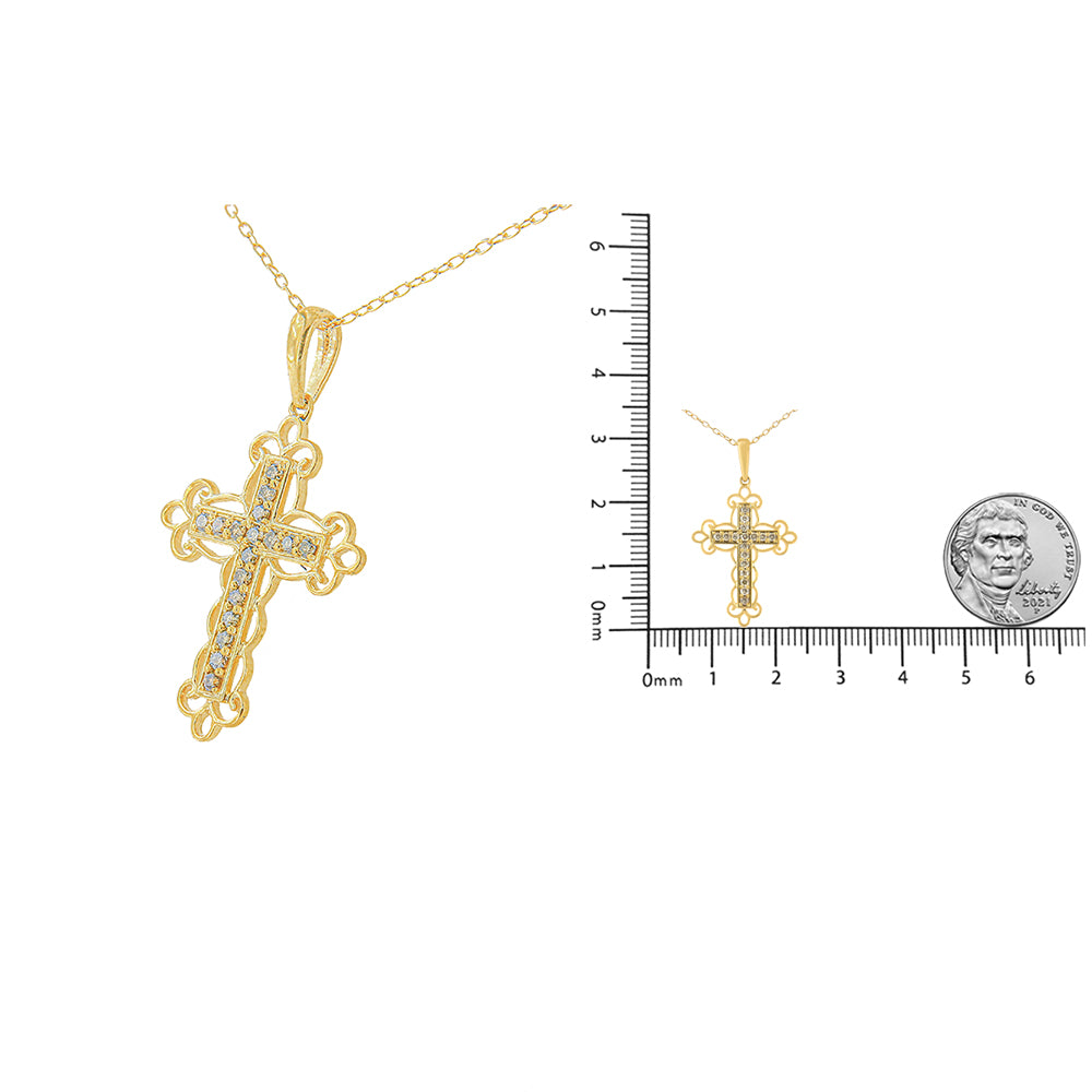 Yellow necklace with a cross pendant featuring round brownish gemstones in prong settings, shown at an angle and also displayed on a ruler and with a coin for size reference.
