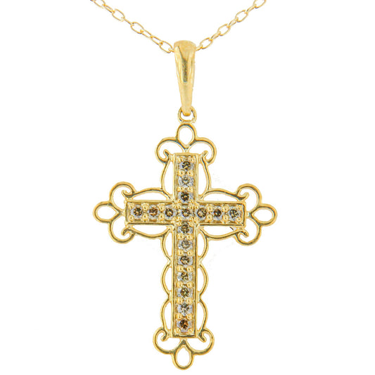 Front-facing shot of a yellow metal cross necklace pendant with round brownish prong-set gemstones arranged in a vertical and horizontal line, surrounded by ornate metalwork.