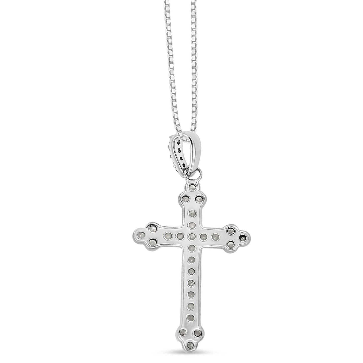 Front view of white metal cross pendant necklace with round white gemstones in prong settings along the cross and bale, hanging from a chain.