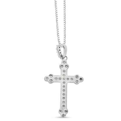 Front view of white metal cross pendant necklace with round white gemstones in prong settings along the cross and bale, hanging from a chain.