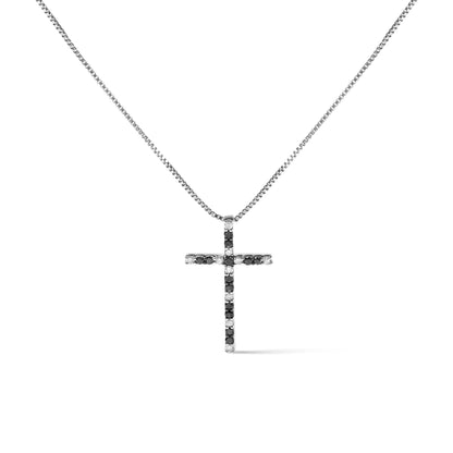 Front view of a white metal necklace with a cross-shaped pendant featuring alternating black and white round gemstones in prong settings.