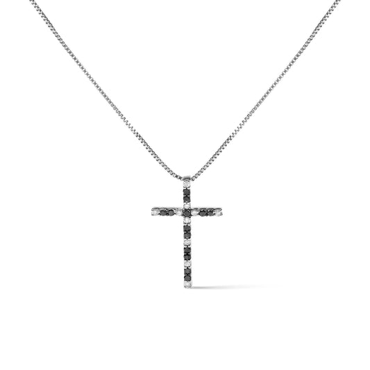 Front view of a white metal necklace with a cross-shaped pendant featuring alternating black and white round gemstones in prong settings.