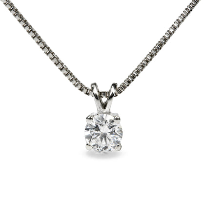 Close-up front view of a white metal necklace with a pendant featuring a single round white gemstone in a four-prong setting.