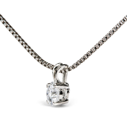 Close-up front angle of a white metal necklace chain with a pendant featuring a single round white gemstone in a 4-prong setting.